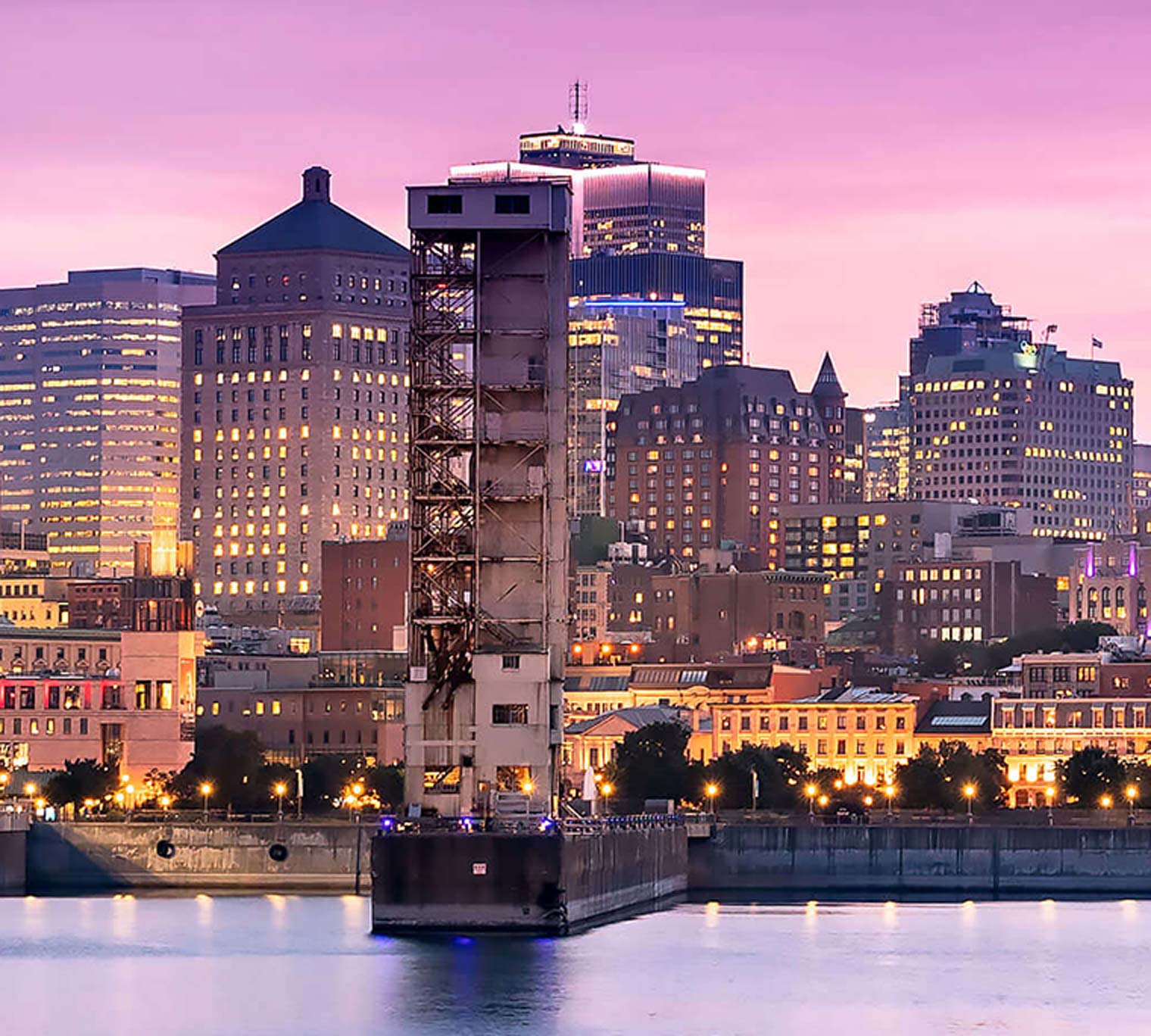 Montreal skyline at night, showing St. Lawrence River; Quebec, Canada
