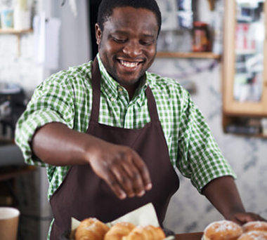 Smiling man working in bakery