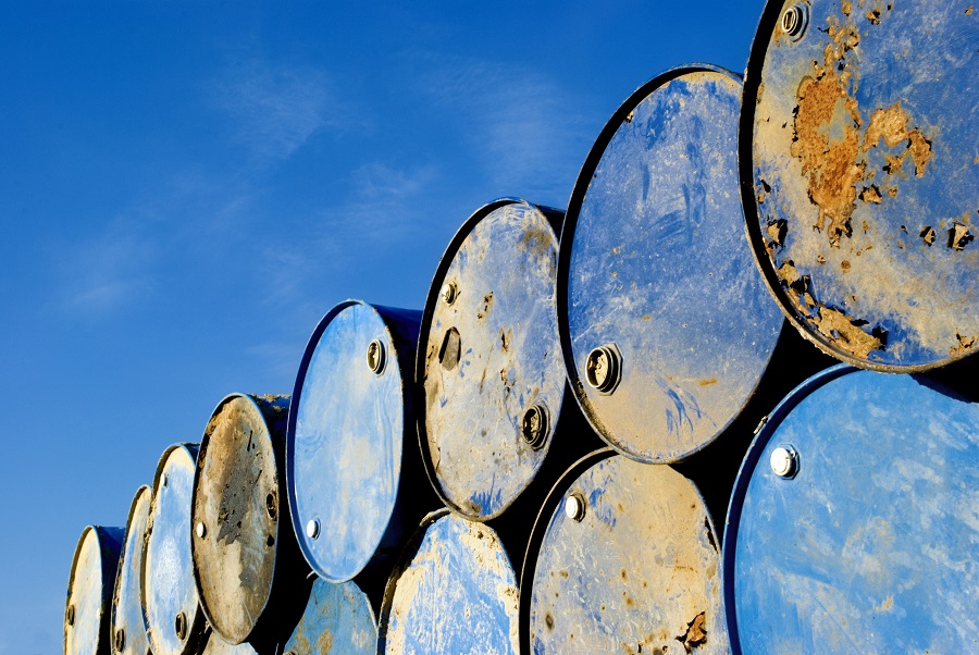Stacked rusty oil barrels