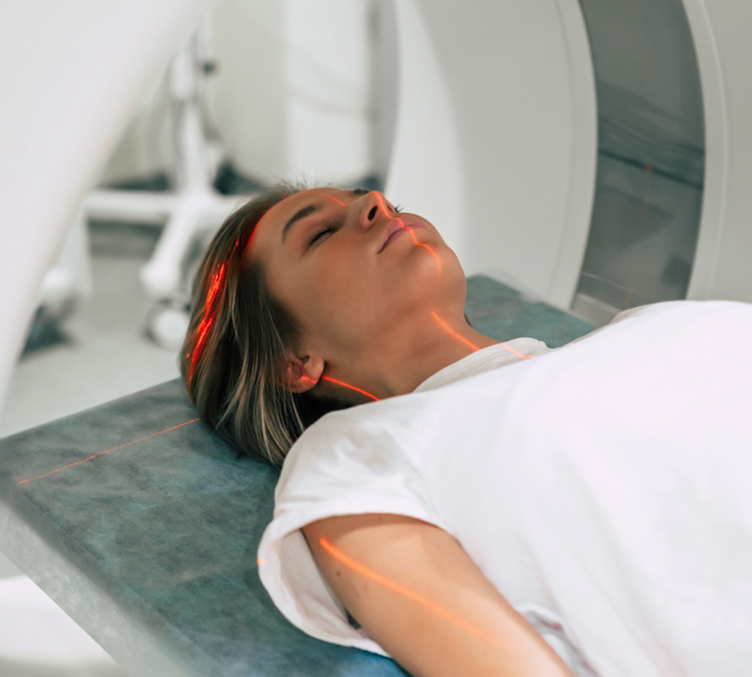 Woman lying in hospital MRI machine.