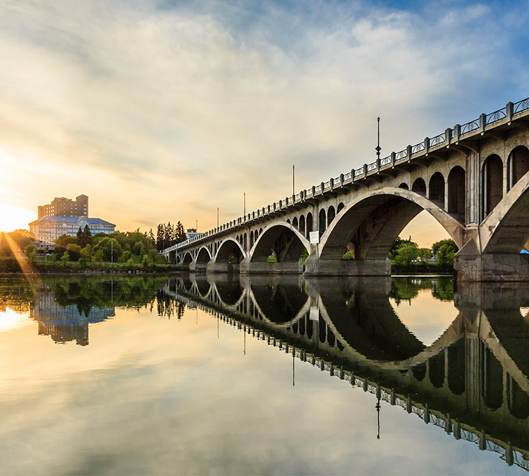 a view of a bridge and canal in Saskatoon