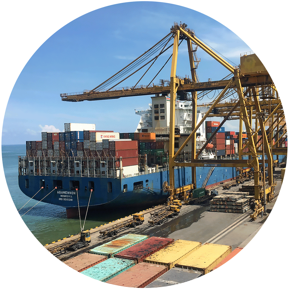 Shipping containers being moved via crane at a port