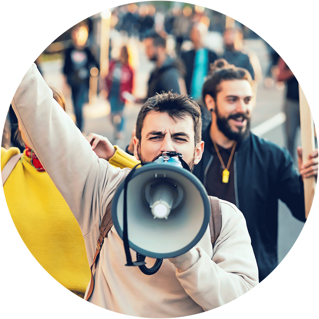 Man yelling into megaphone during a protest