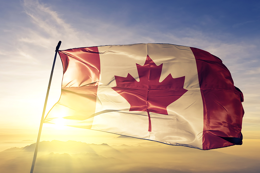 Sun shining through Canadian flag