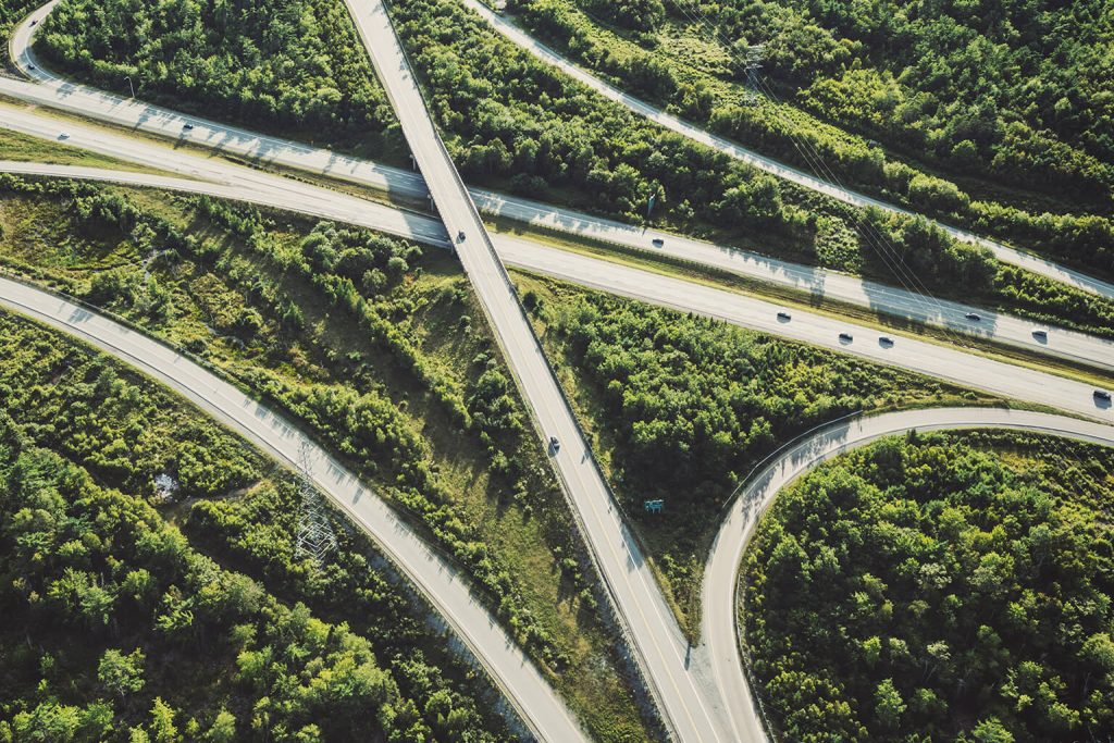 Aerial view of a highway and forest
