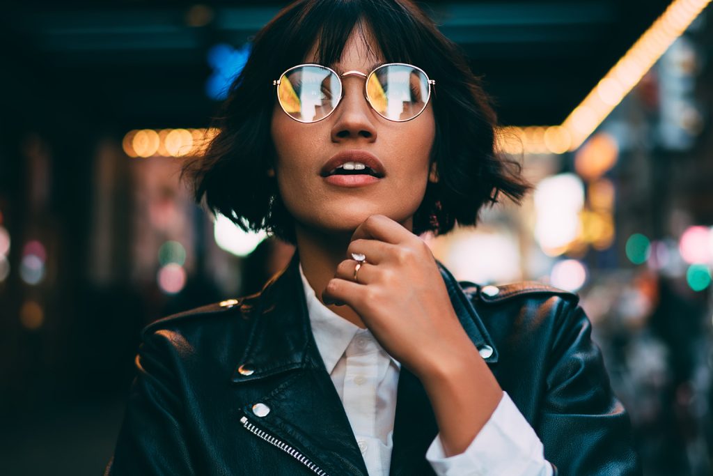 Woman wearing glasses in urban environment