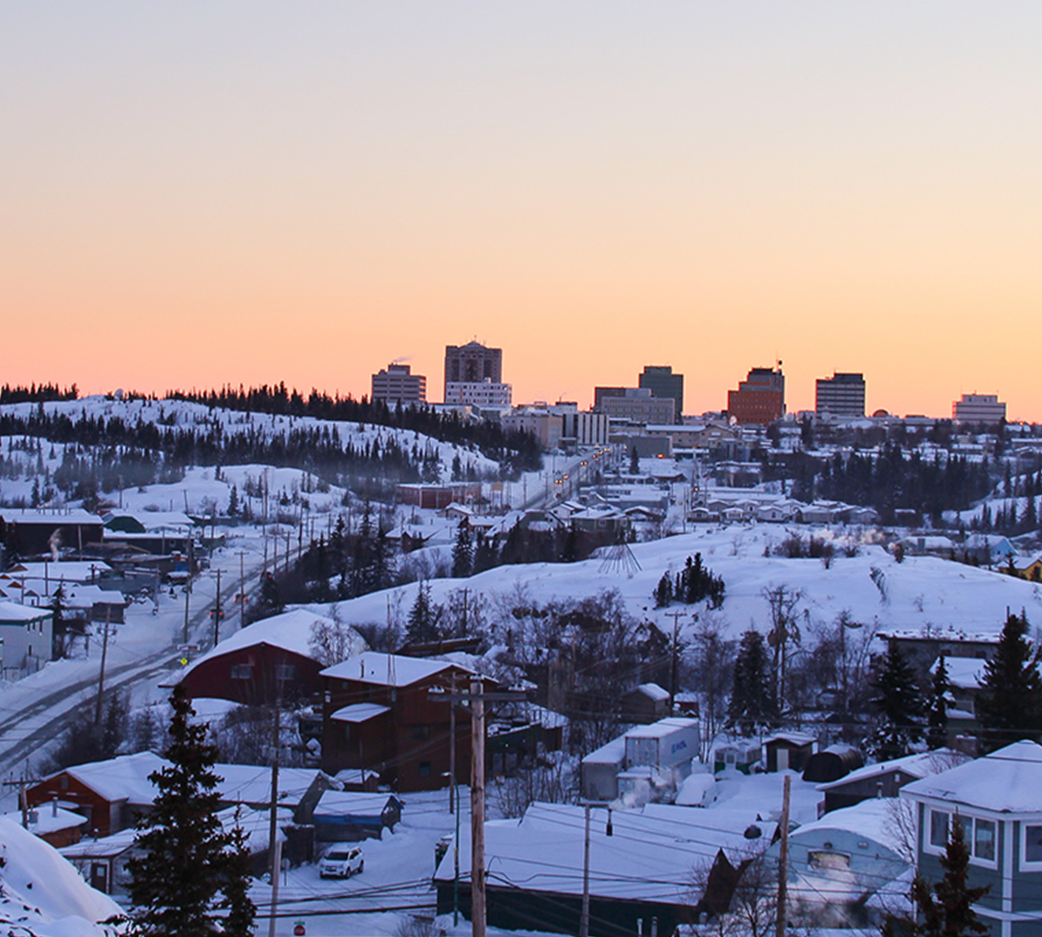 A view of the Yellowknife cityscape at sunset